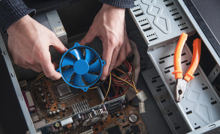 Man repairs cooling system of computer.
