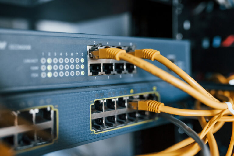 Close up view of internet equipment and cables in the server room.